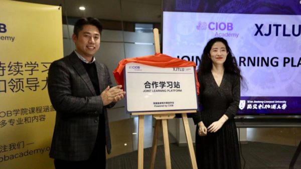 Dr. Xin Bi, left, director of the Learning Mall and the Centre for Knowledge and Information, and Qiong Wu, CIOB East Asia training manager launch partnership 15 December