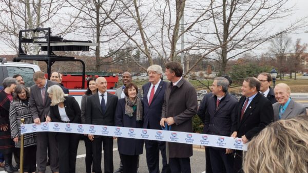 Virginia governor Glenn Youngkin wields giant scissors at the ribbon-cutting ceremony marking the opening of the I-66 Managed Lanes toll road in Virginia at the end of November 2022 (Courtesy of Ferrovial)