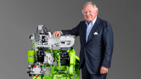 JCB chairman Lord Bamford shows off the engine, developed by some 100 engineers working for more than a year (Courtesy of JCB)