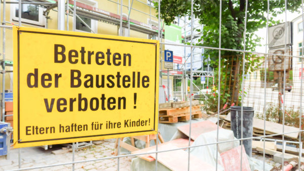 Site sign in German says “No Trespassing. Parents are responsible for their children.” German construction output in 2023 is expected to be worth around half a trillion dollars (Tomnex/Dreamstime.com)