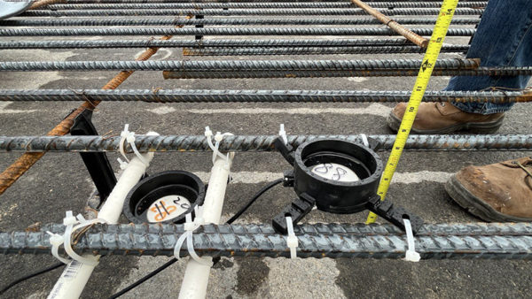 Attached to rebar or formwork and buried under the pour, the sensors send data about the concrete’s condition directly to engineers’ phones (Photograph by Prof Luna Lu)
