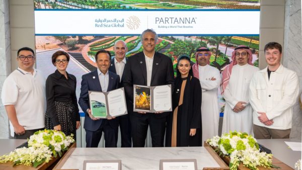 Red Sea Global chief executive John Pagano, second from left, with Partanna co-founder Rick Fox announcing the purchase agreement (Courtesy of Red Sea Global)