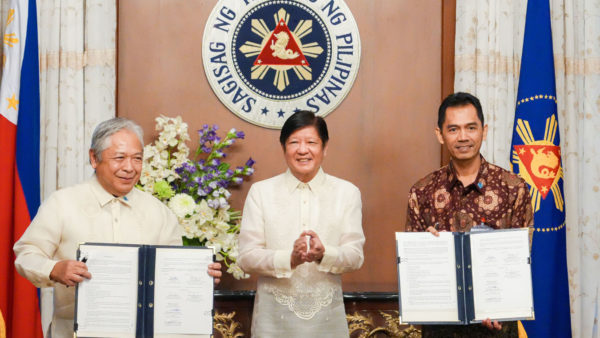 President of the Philippines, Ferdinand R. Marcos Jr., centre, after signing contracts for the South Commuter Railway Project on 13 July (Courtesy of the Presidential Communications Office of the President of the Philippines)