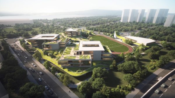 The school has a multilevel layout that keeps teaching spaces away from the motorway (10 Design)