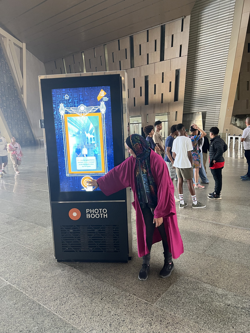 The first parties of visitors have already begun arriving at the museum for abbreviated tours. One attraction in the atrium is a machine that will email your portrait alongside Rameses II, demonstrated here by design coordinator Mennatallah Heikal