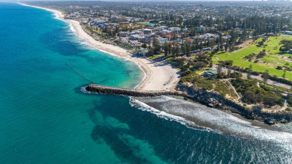 Cottesloe Beach, Perth, which gets nearly twice the amount of sunshine as London (Nathan Hurst/Unsplash)