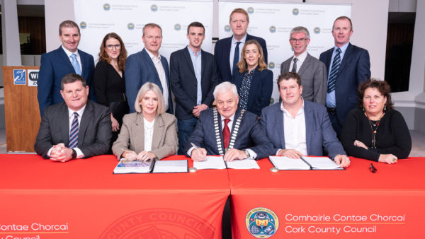 Cork County Mayor Cllr. Frank O’Flynn, centre front, and, to his right, Cork County Council Chief Executive Valerie O’Sullivan, sign Jacobs on to the role with council and Jacobs officials (Gerard McCarthy/Courtesy of Jacobs)