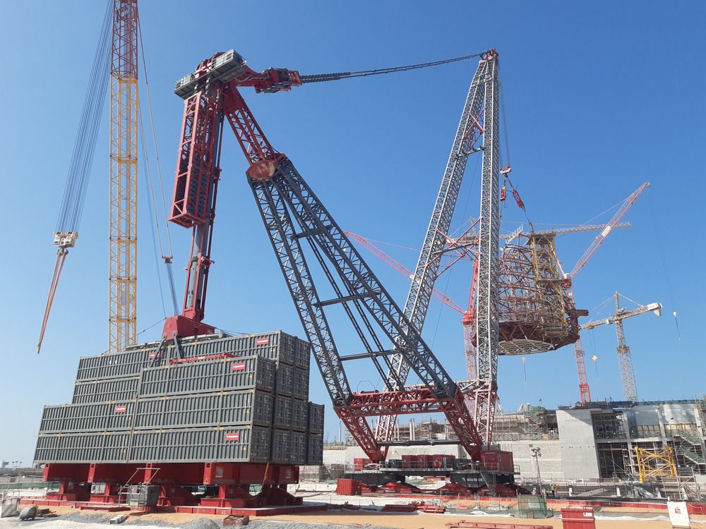Wing-shaped towers soar into place with giant crane at Abu Dhabi museum